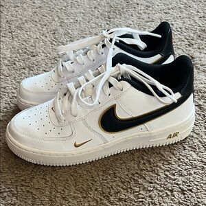 White and Black Sneakers with Gold Accents